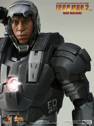 Illustration for article titled How Does War Machine's Gun Work? Can He Sit Down? New Toy Pics Reveal All!